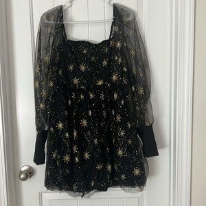 This is a black dress with golden designs.
